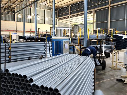 Grey pipe bundles on the factory floor
