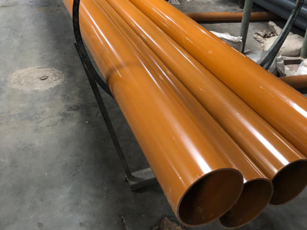 Orange pipes on a production line